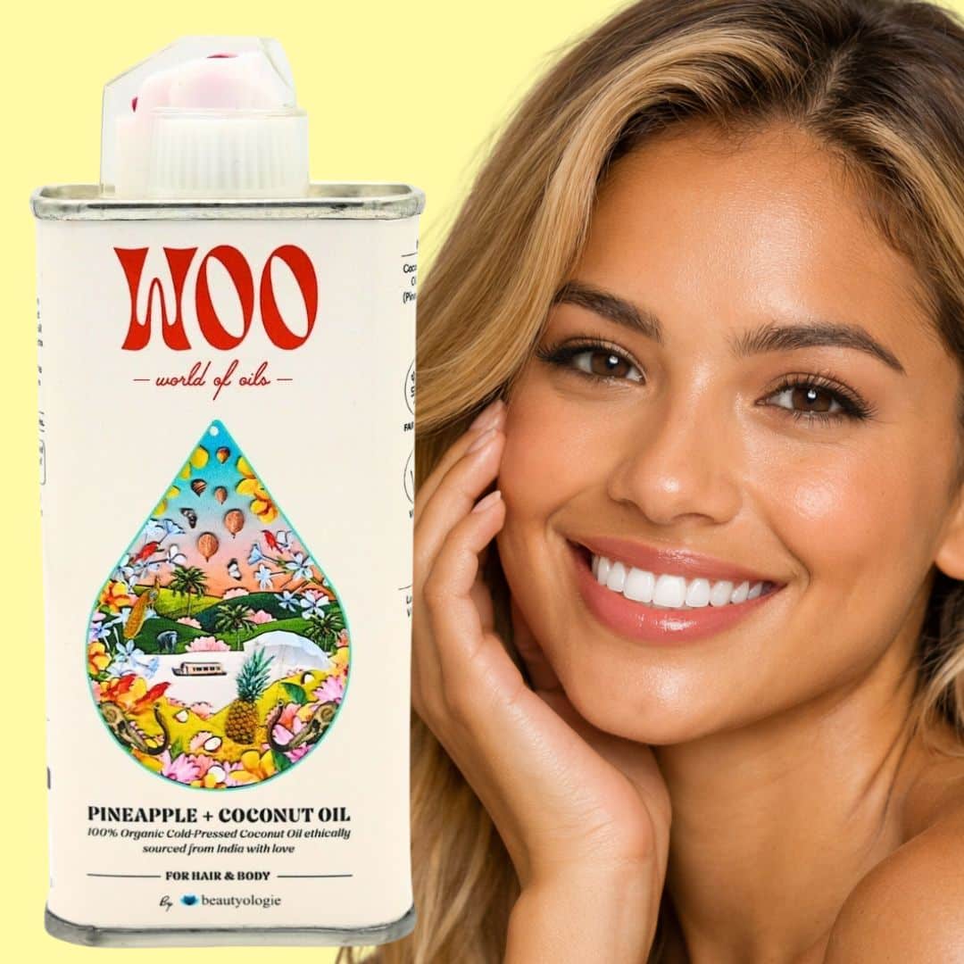 Smiling woman with coconut oil product.