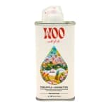 Woo pineapple coconut oil bottle for hair and body.