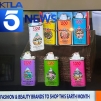 Colorful MOO body oil tins on news display