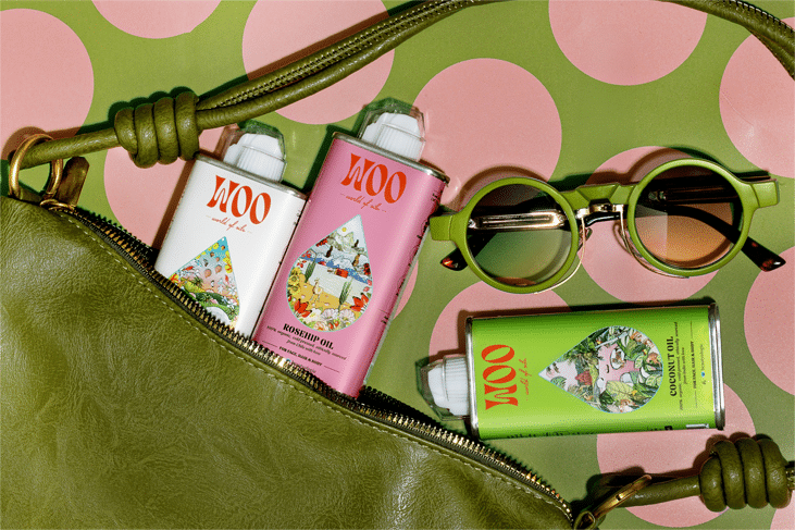 43 Skincare sprays and sunglasses in green bag