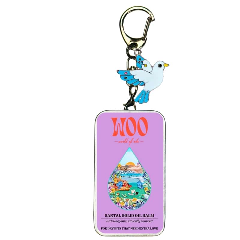 Bird charm keychain with Santal Solid Oil Balm tag