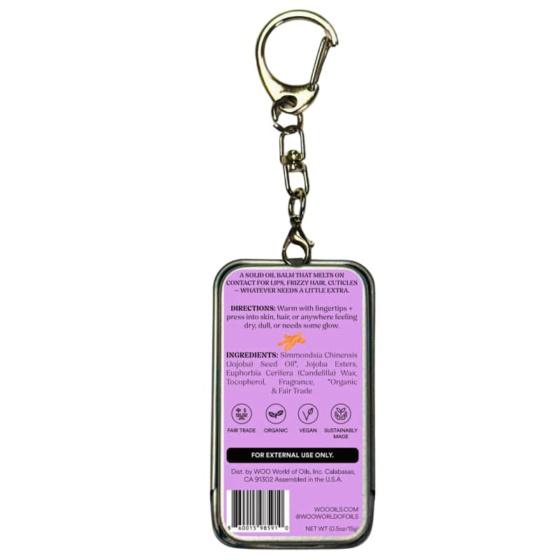 Purple oil balm tin with keychain clip