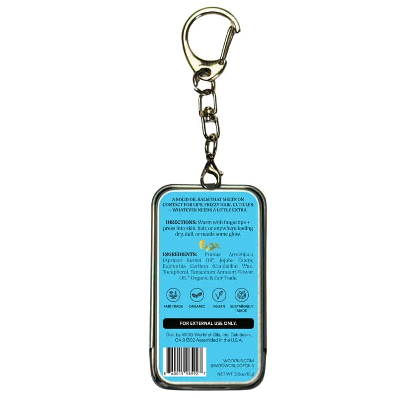 Metal keychain tin with blue balm label